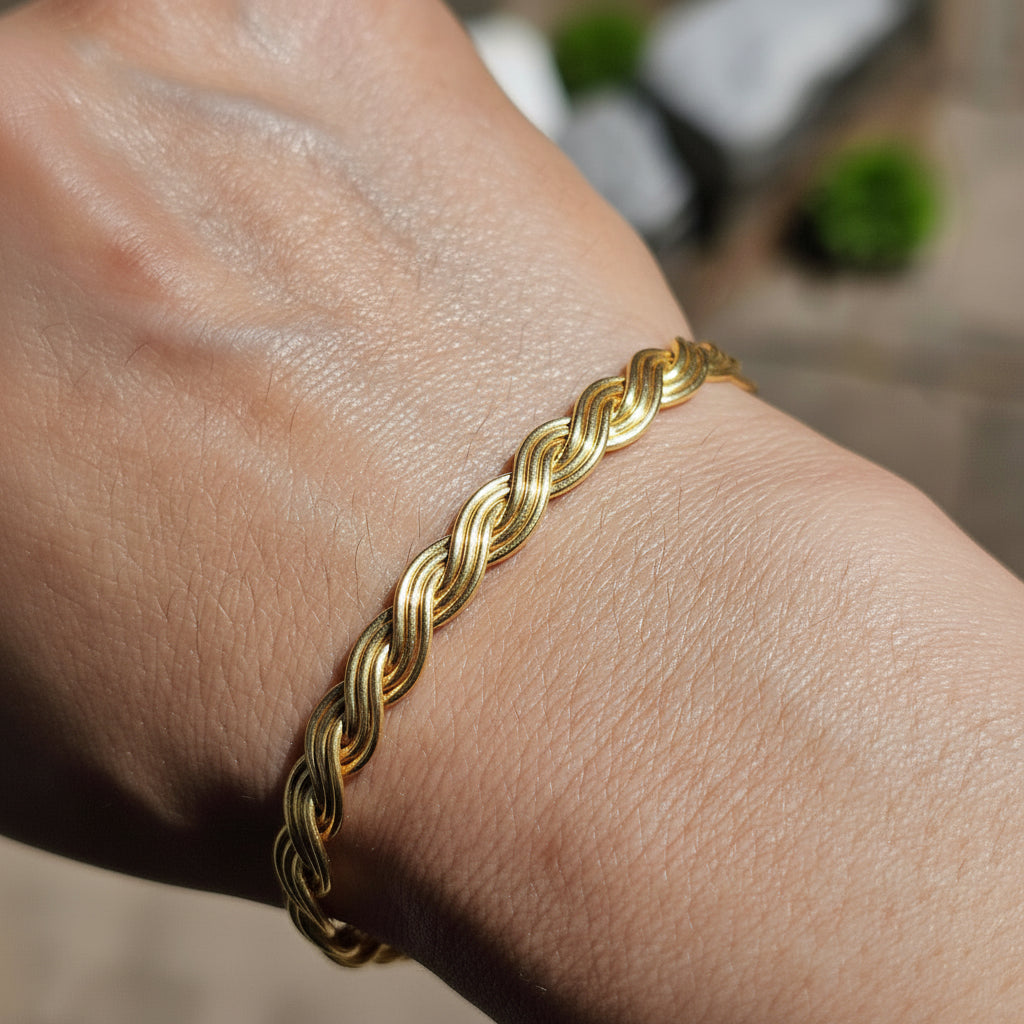 a handmade 14K Gold-Filled goddess braid 6 strand bracelet on a wrist