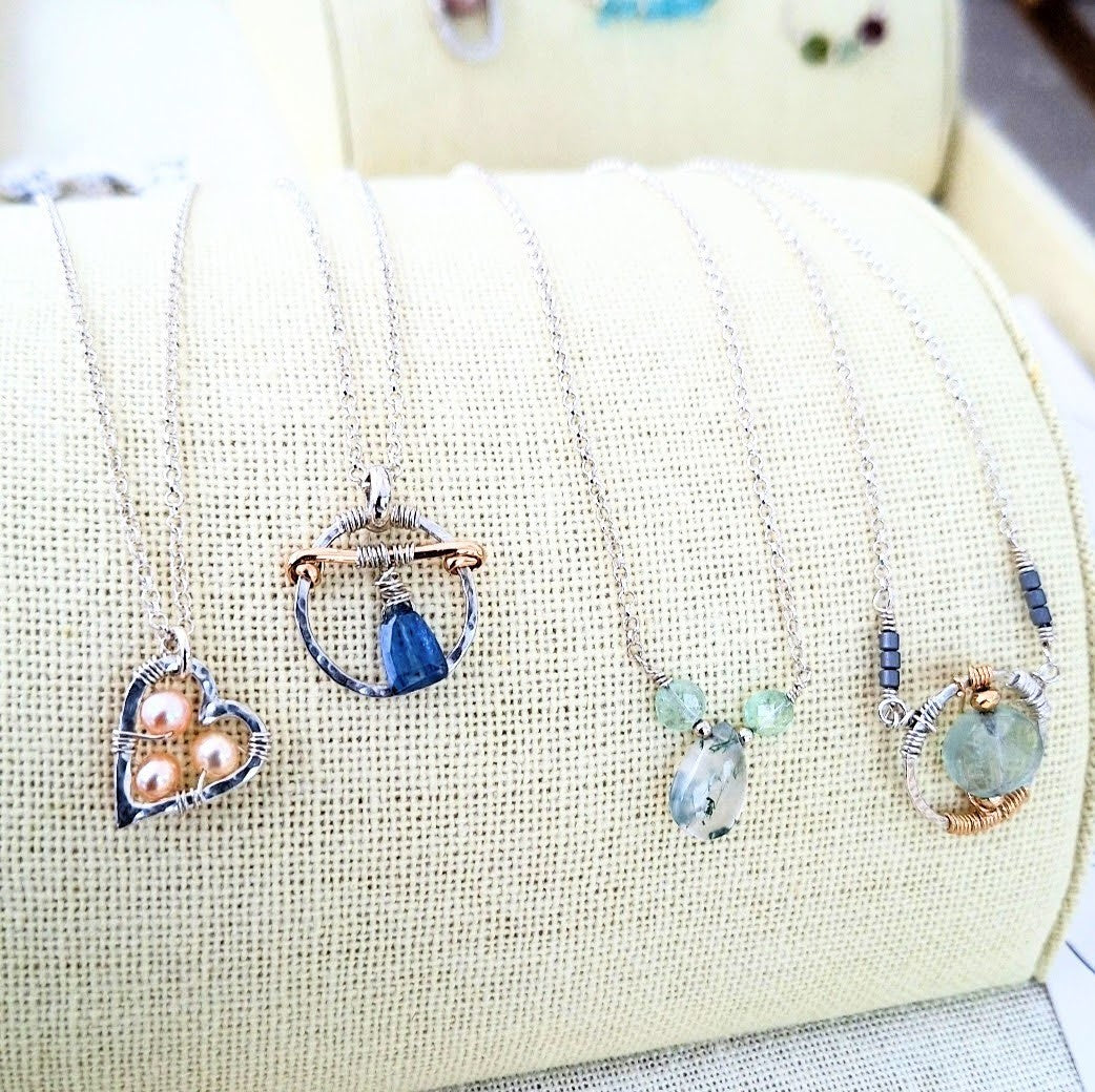 Gemstone and sterling silver necklaces, featuring freshwater pearls, Moss Agate, Fluorite, Blue Kyanite, and 14 karat Gold-filled metal