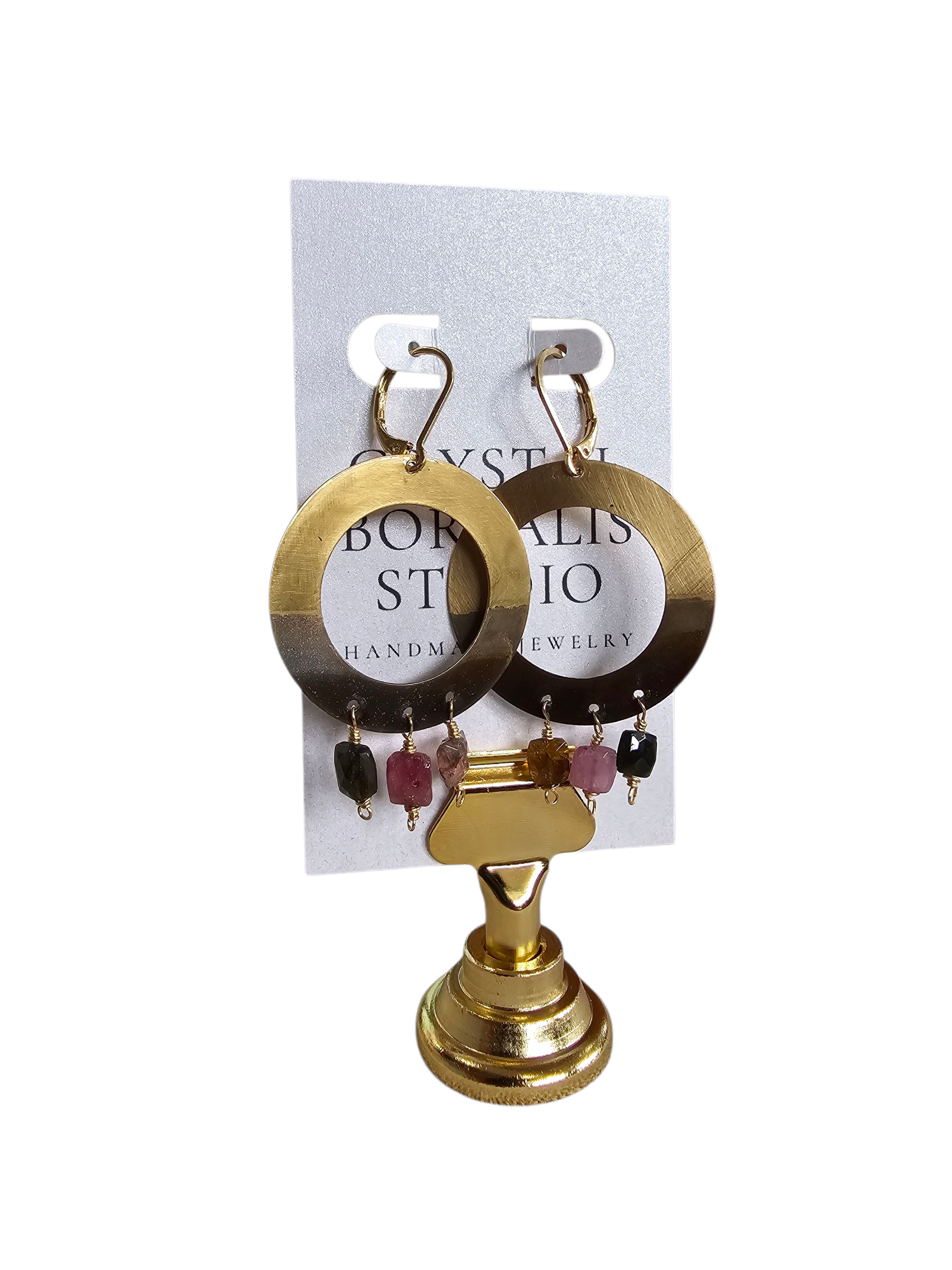 Gold hoop earrings with dangling beads on a display card.