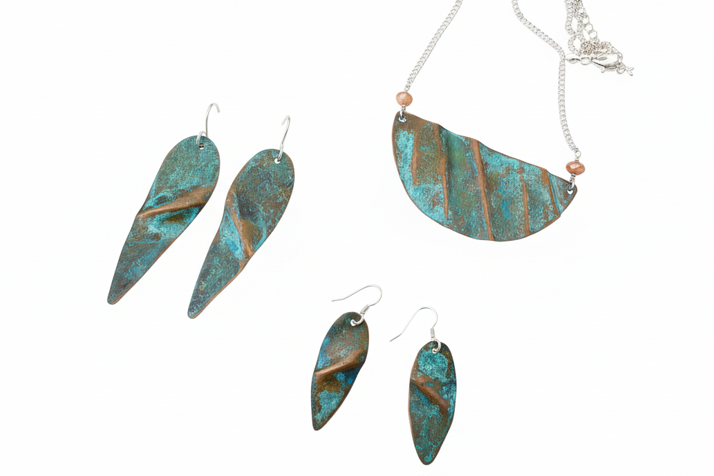 Handcrafting bohemian patina earrings with sterling silver ear wires. 